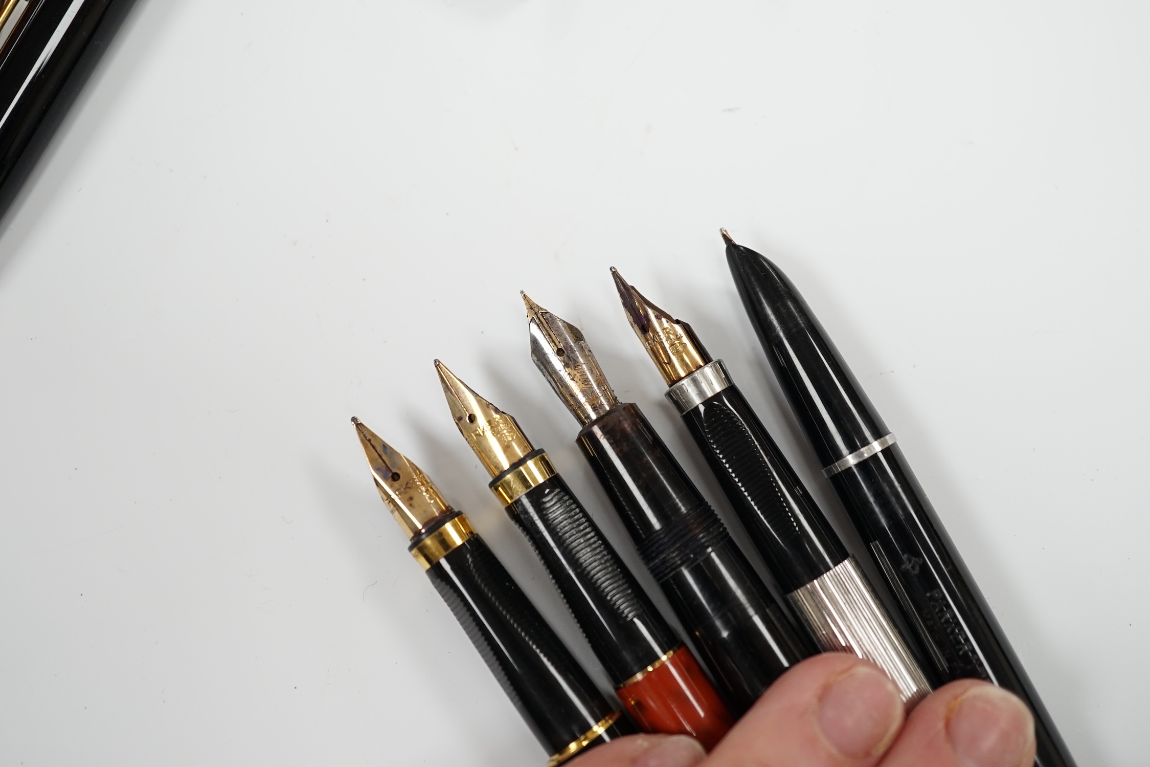 A Parker white metal fountain pen and four other Parker fountain pens, the vendor being an ex-Parker Pen employee